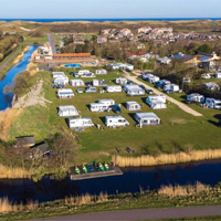 Zwaaien gelijkheid groot camping 't Noorder Sandt in Noord-Holland, Julianadorp - stacaravans, tenten,  glamping